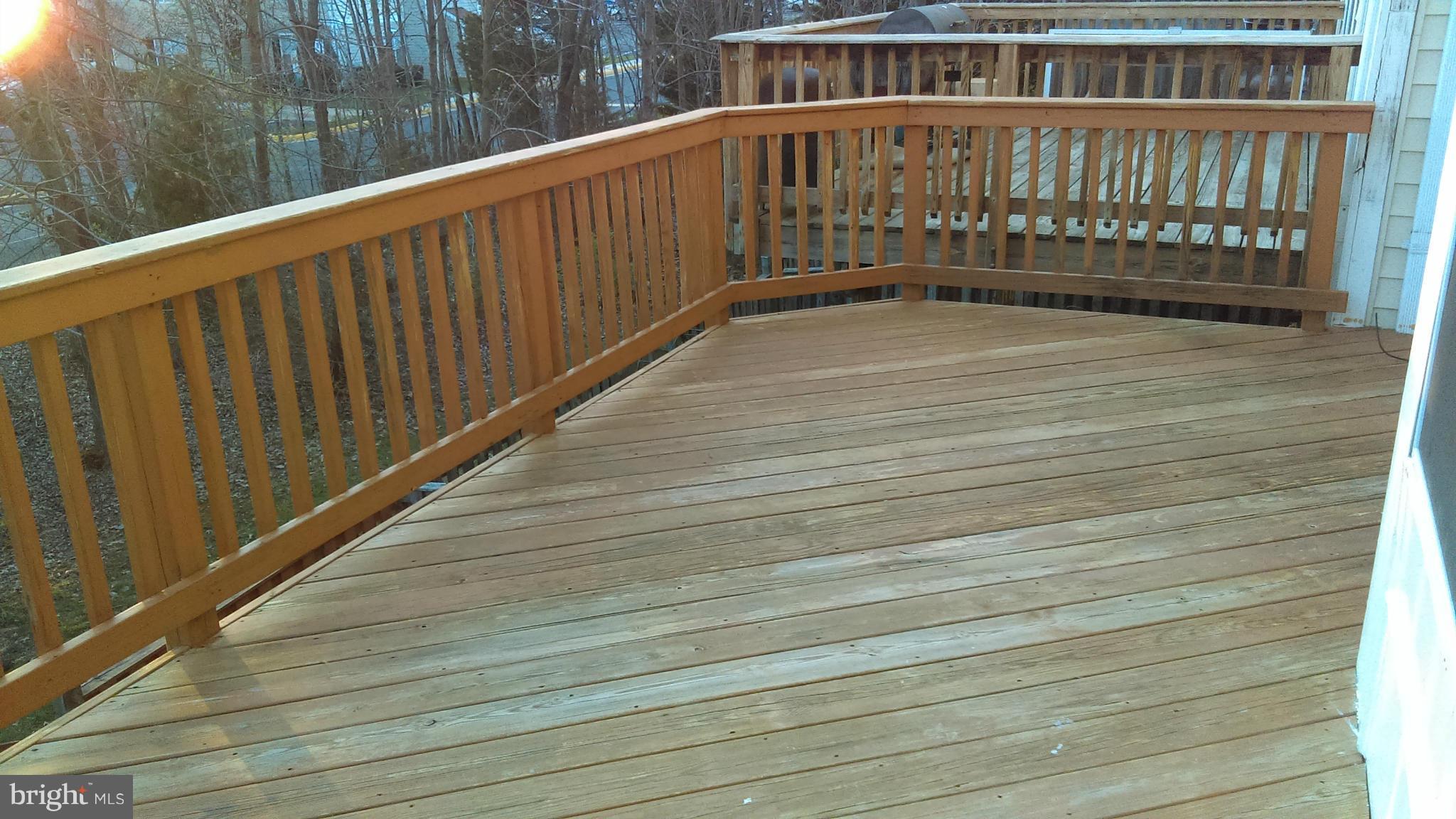 11117 Light Guard Loop Manassas, VA 20109 - Photo 24 of 25 a view of wooden balcony with outdoor space