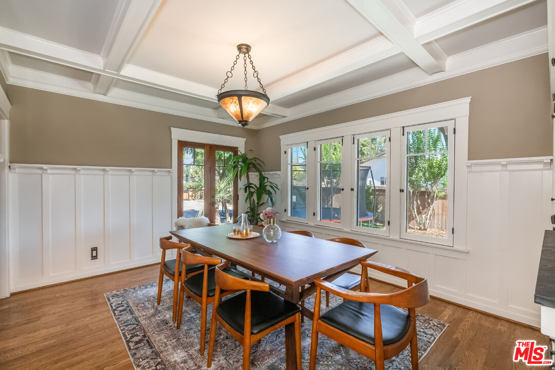 8712 Duarte Road San Gabriel, CA 91775 - Photo 14 of 52 a view of a dining room with furniture wooden floor and chandelier