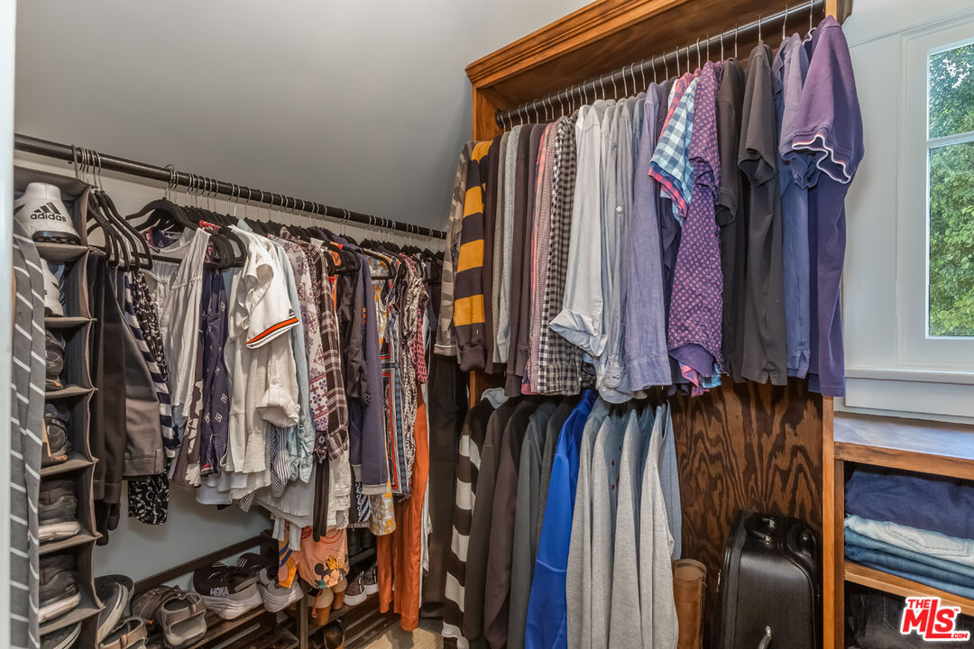 8712 Duarte Road San Gabriel, CA 91775 - Photo 22 of 52 a view of walk in closet with clothes