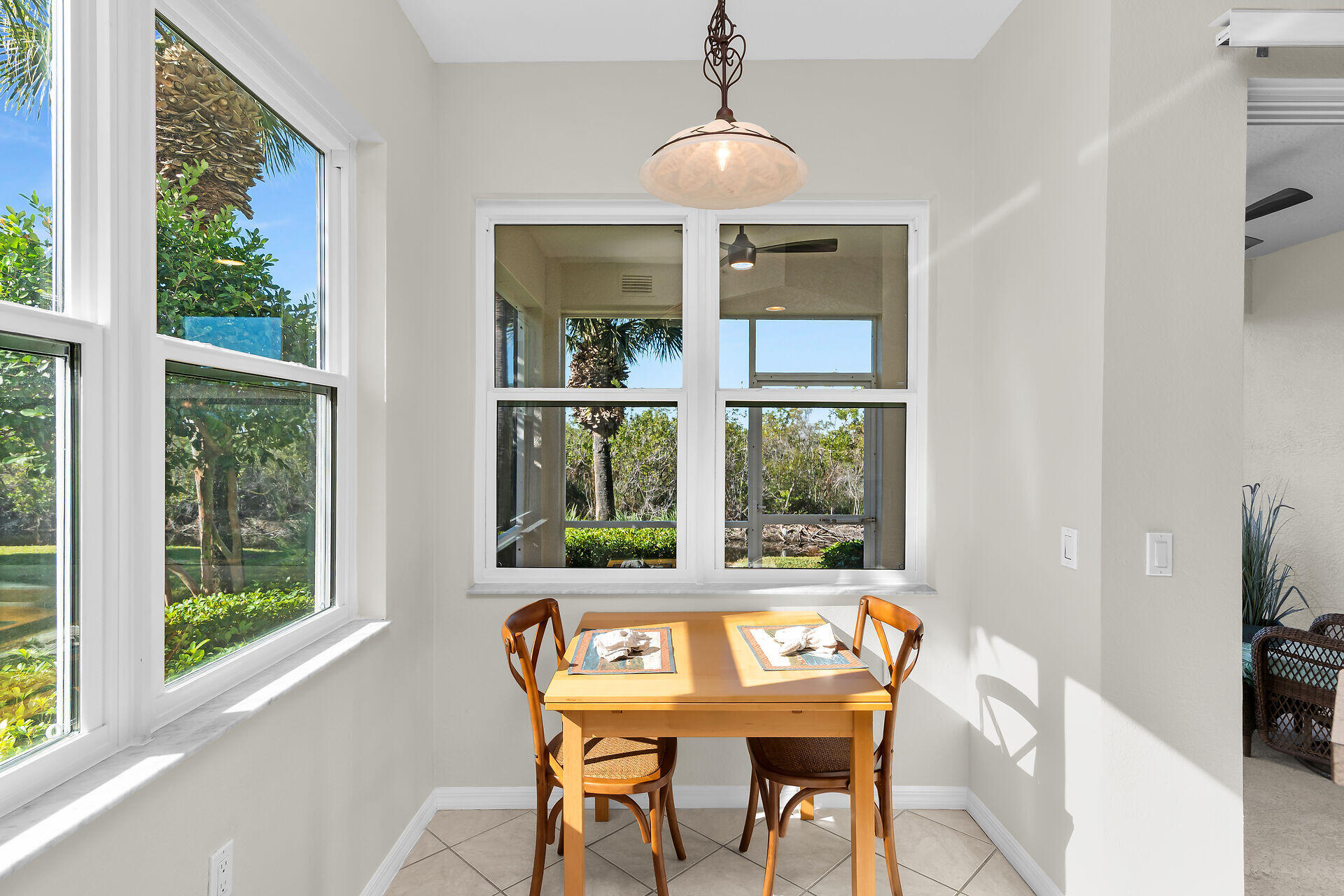 4685 Hawks Nest Way, Unit 101 Naples, FL 34114 - Photo 12 of 43 a view of a dining room with furniture window and outside view