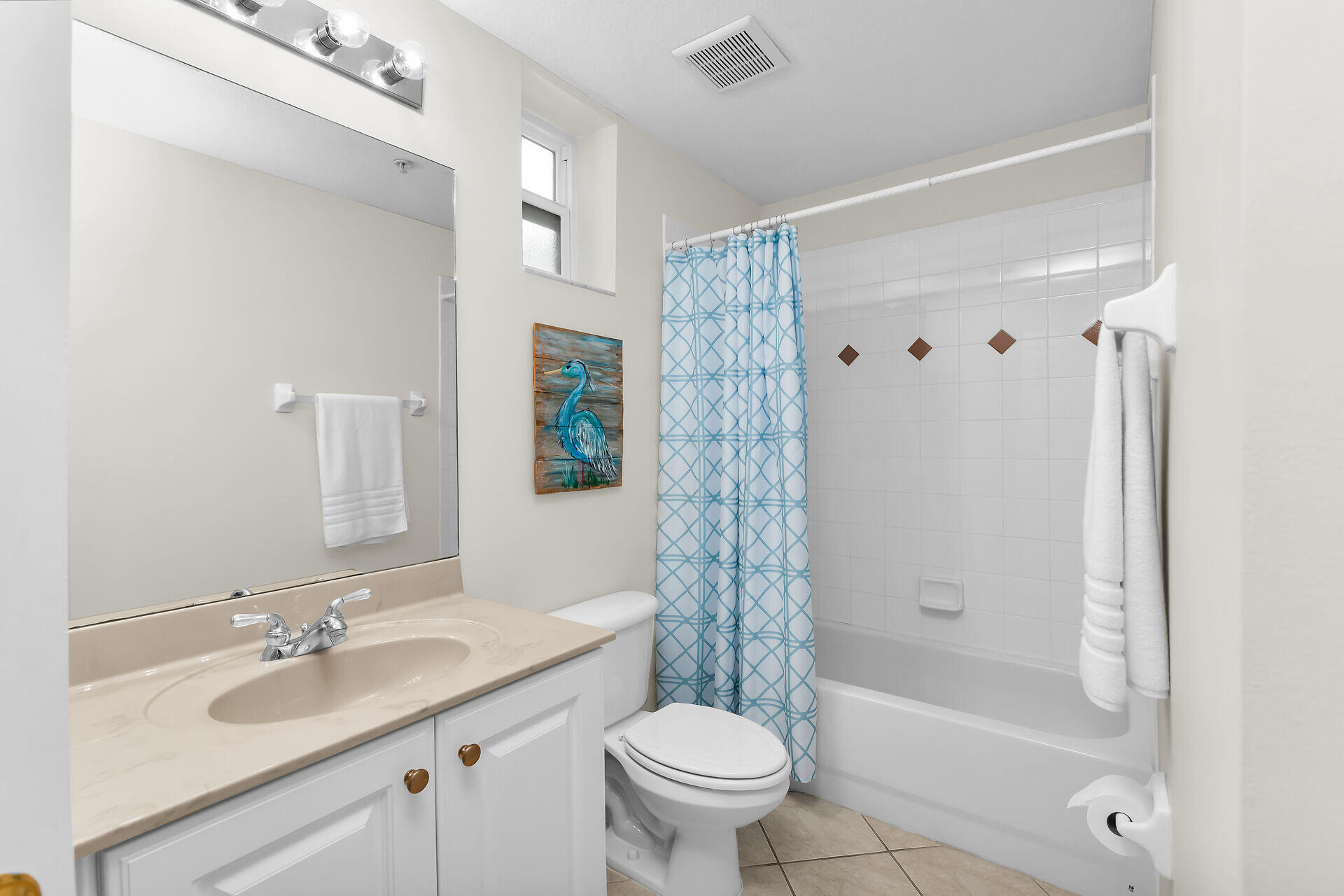 4685 Hawks Nest Way, Unit 101 Naples, FL 34114 - Photo 17 of 42 a bathroom with a granite countertop sink a toilet and shower