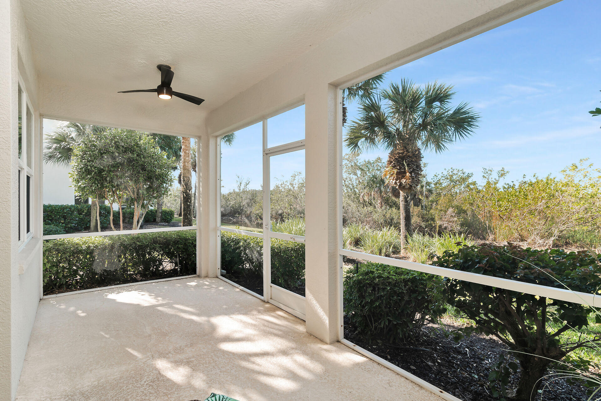 4685 Hawks Nest Way, Unit 101 Naples, FL 34114 - Photo 22 of 43 a balcony view with a garden