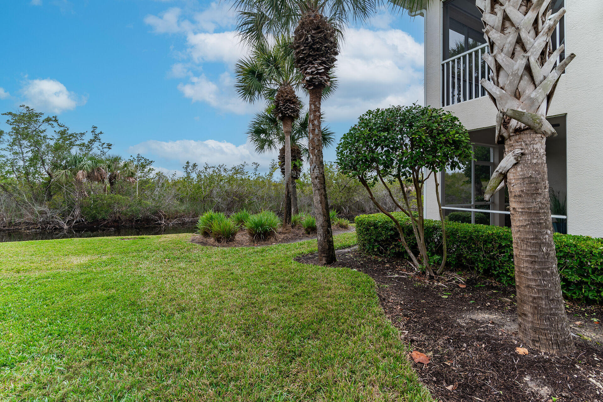 4685 Hawks Nest Way, Unit 101 Naples, FL 34114 - Photo 23 of 43 a view of a garden with a tree