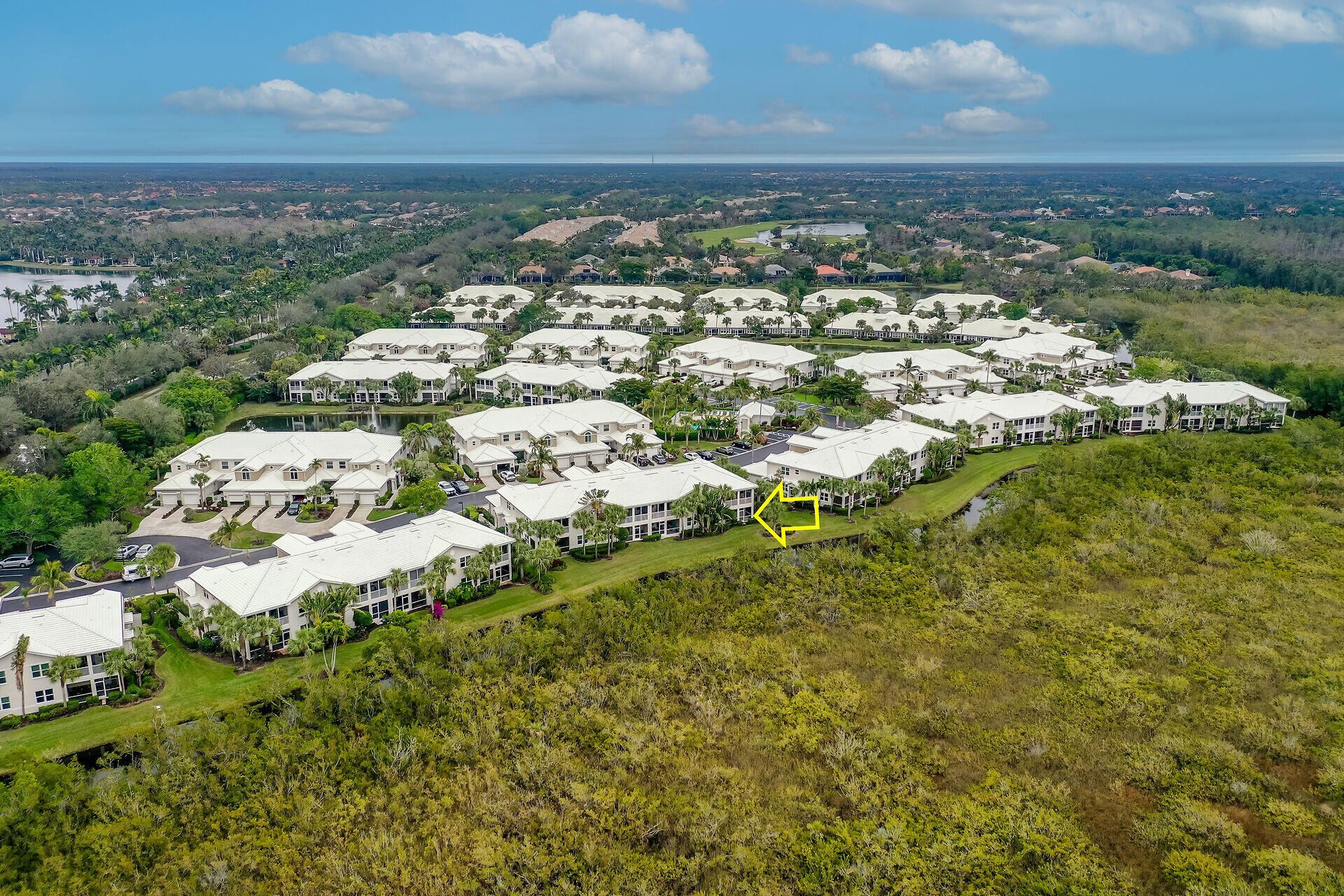 4685 Hawks Nest Way, Unit 101 Naples, FL 34114 - Photo 31 of 42 an aerial view of residential house with parking space