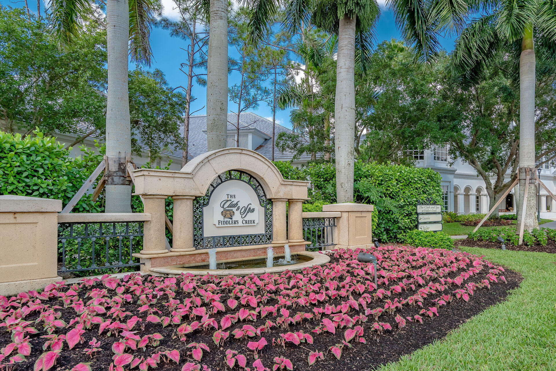 4685 Hawks Nest Way, Unit 101 Naples, FL 34114 - Photo 42 of 43 a front view of a house with garden
