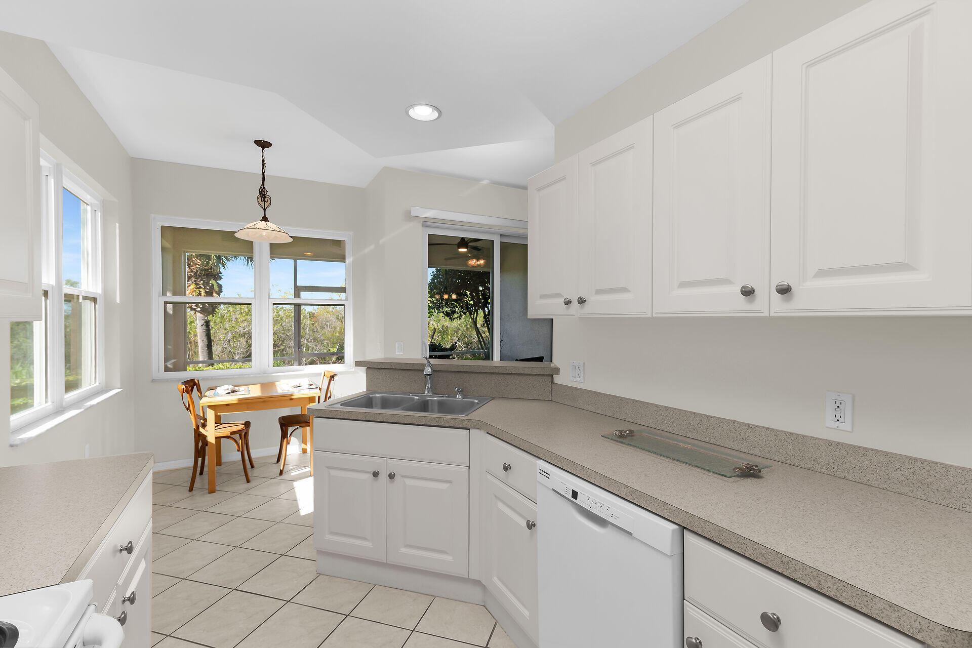 4685 Hawks Nest Way, Unit 101 Naples, FL 34114 - Photo 10 of 43 a kitchen with a sink and cabinets