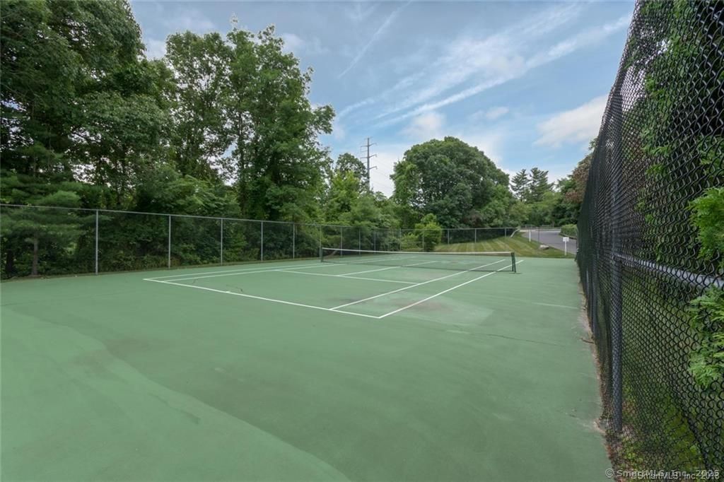 84 Wilton Crest Road, Unit 84 Wilton, CT 06897 - Photo 12 of 16 a view of a tennis court
