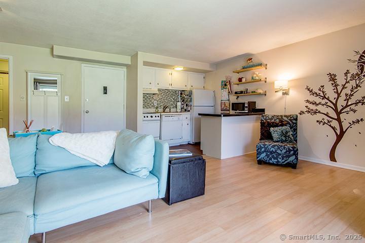 84 Wilton Crest Road, Unit 84 Wilton, CT 06897 - Photo 5 of 16 a kitchen with stainless steel appliances granite countertop a refrigerator and a sink