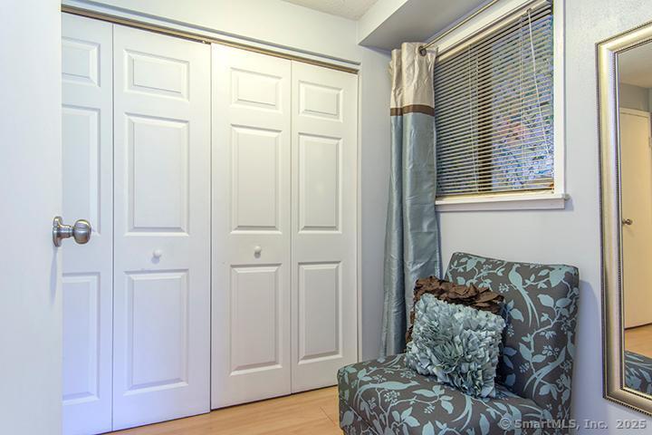 84 Wilton Crest Road, Unit 84 Wilton, CT 06897 - Photo 8 of 16 a bedroom with furniture and a window