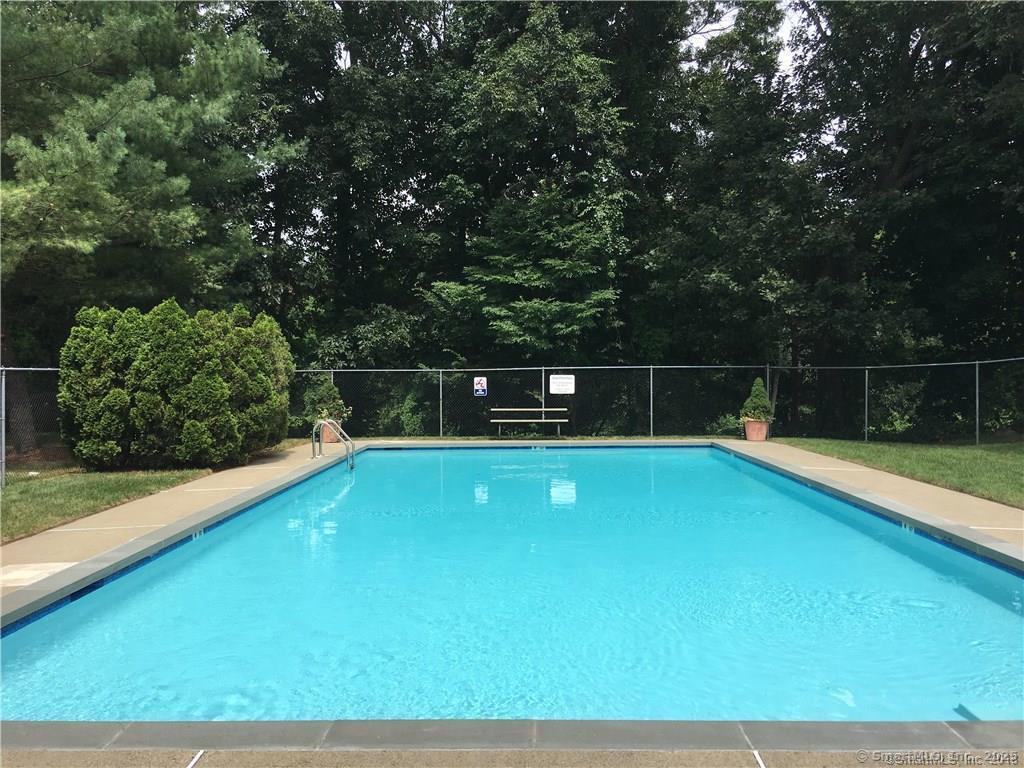 84 Wilton Crest Road, Unit 84 Wilton, CT 06897 - Photo 9 of 16 a view of a tennis court