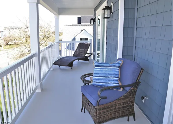 a view of balcony with furniture