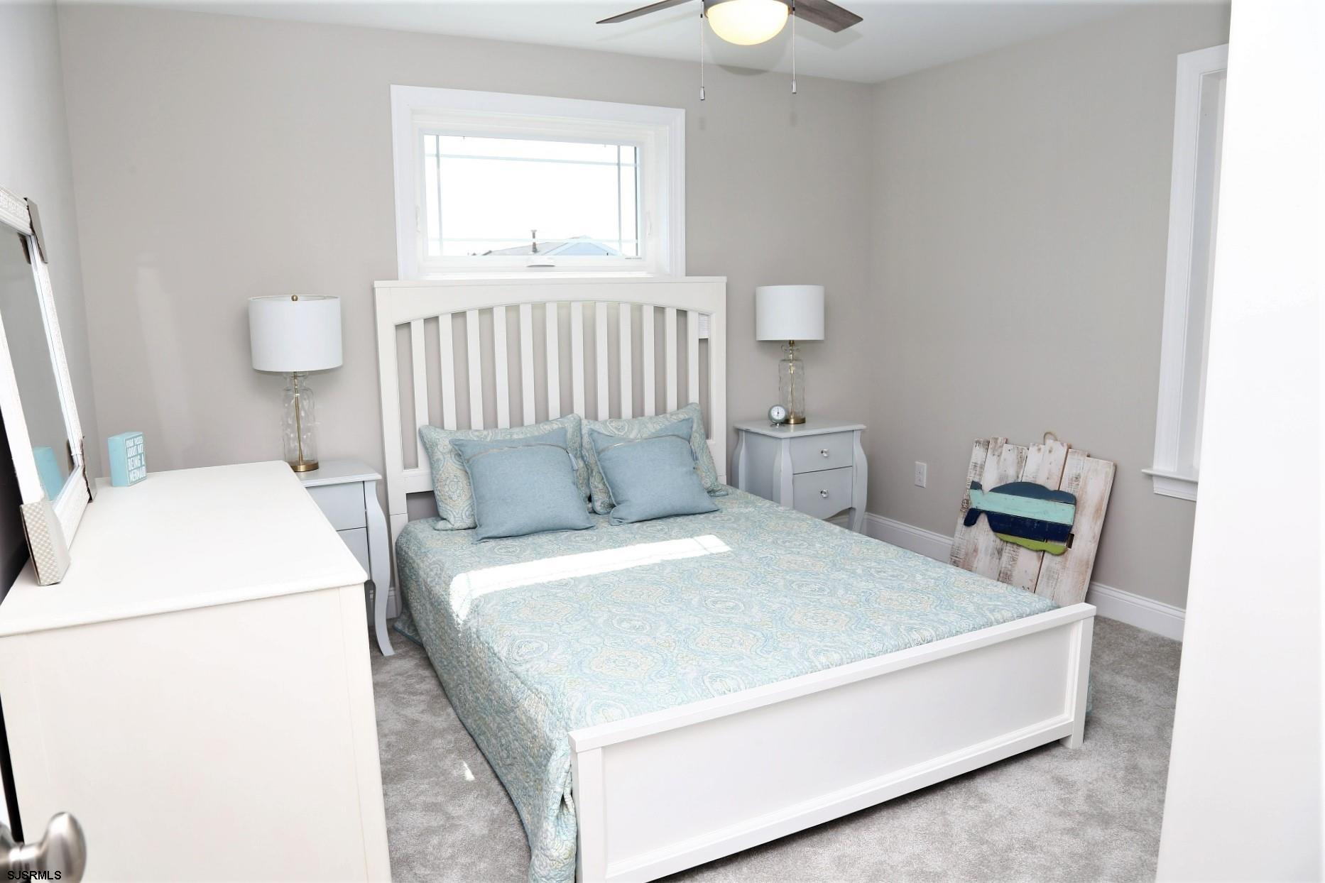 336 32nd Street South Brigantine, NJ 08203 - Photo 15 of 25 a bed room with a bed and a window