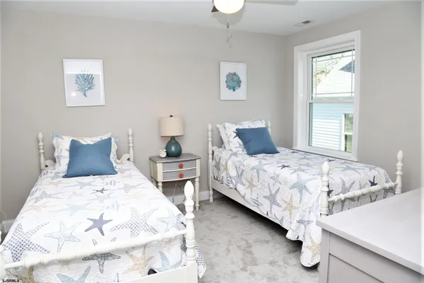 a bedroom with bed and a window