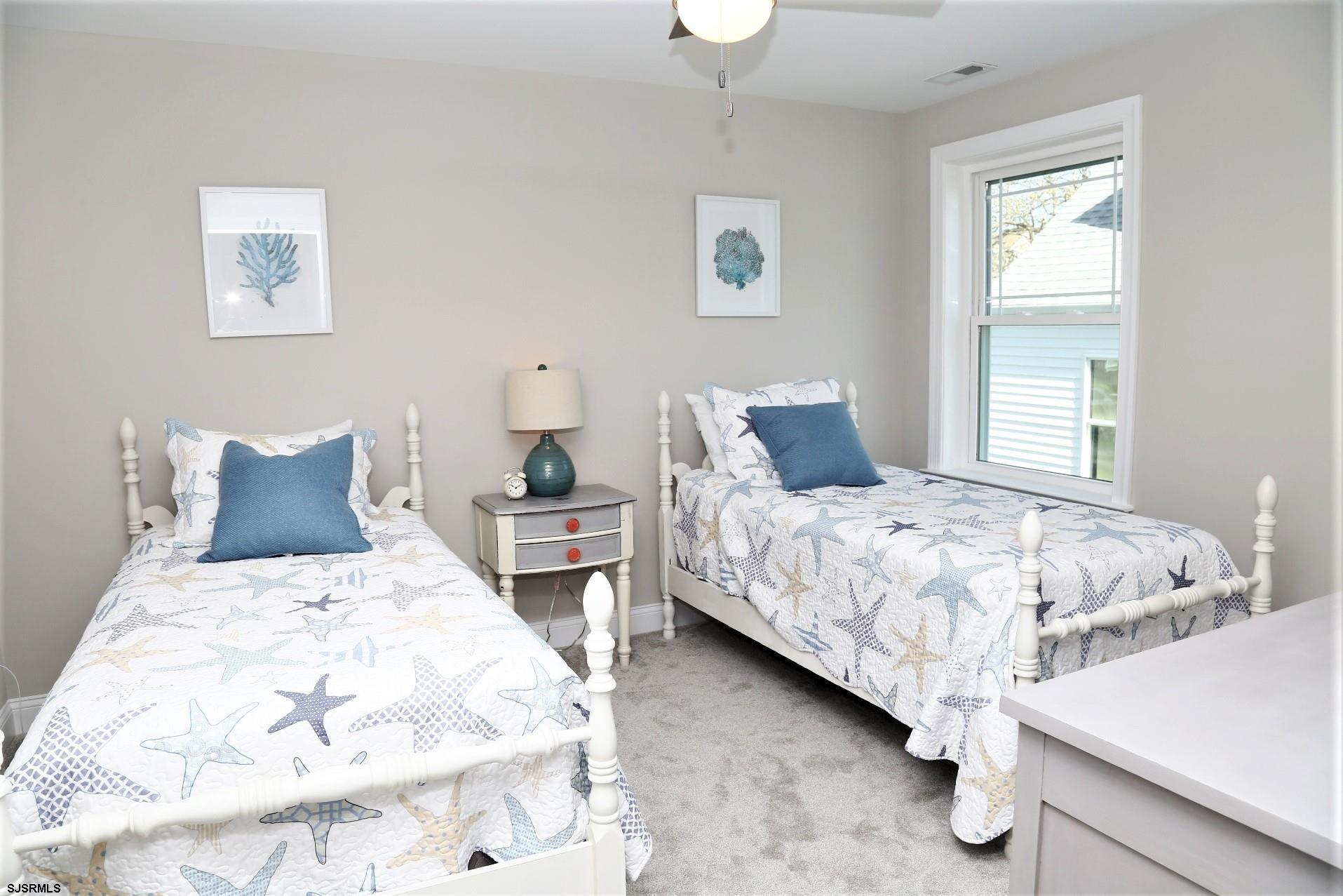 336 32nd Street South Brigantine, NJ 08203 - Photo 20 of 25 a bedroom with bed and a window