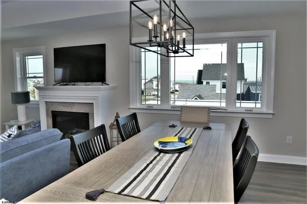 a living room with furniture fireplace and flat screen tv