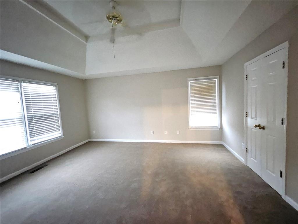 144 Hunters Trace Dallas, GA 30157 - Photo 17 of 34 an empty room with a empty space and windows