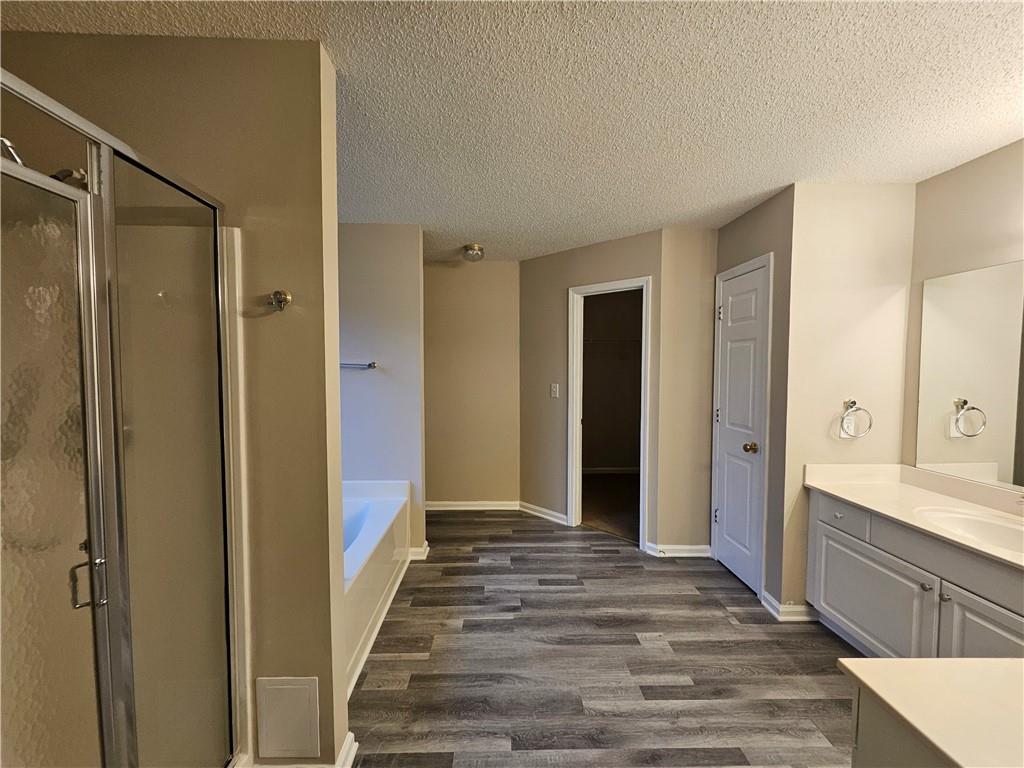 144 Hunters Trace Dallas, GA 30157 - Photo 20 of 34 a spacious bathroom with a shower and a sink