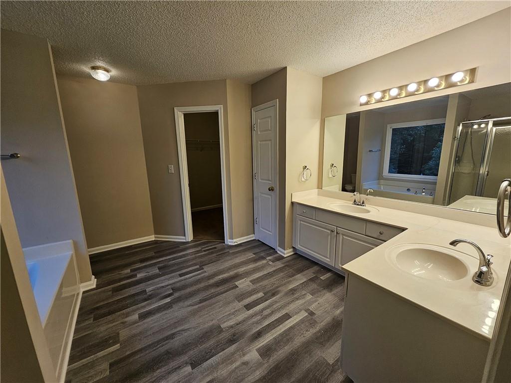144 Hunters Trace Dallas, GA 30157 - Photo 22 of 34 a bathroom with double vanity sink and mirror
