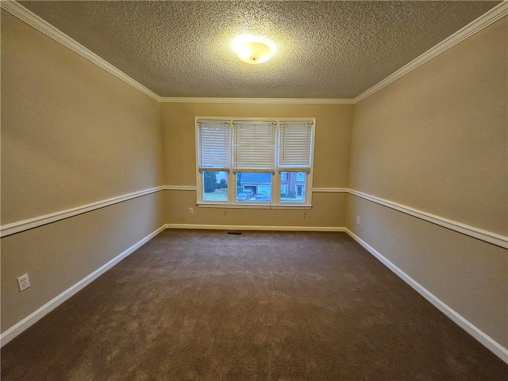 144 Hunters Trace Dallas, GA 30157 - Photo 23 of 34 an empty room with windows