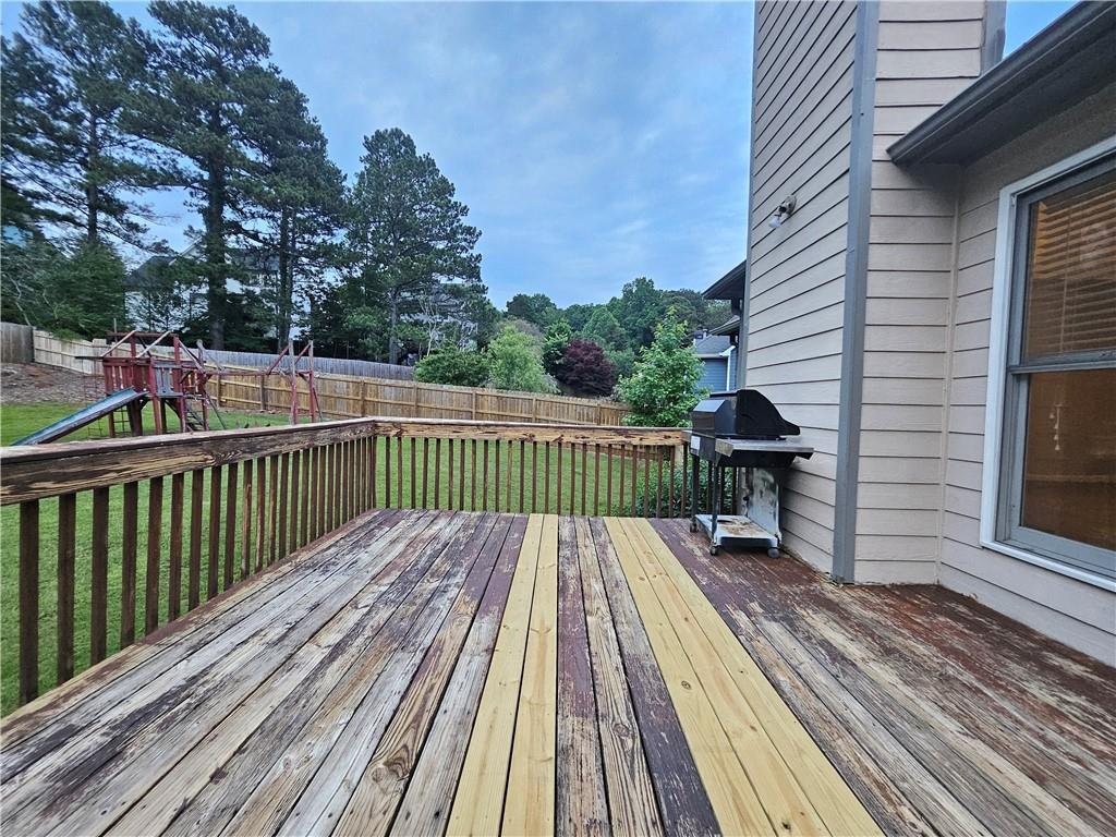 144 Hunters Trace Dallas, GA 30157 - Photo 28 of 34 a view of balcony with wooden floor and fence