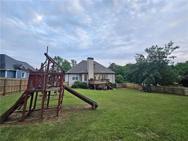 a view of outdoor space with garden and deck