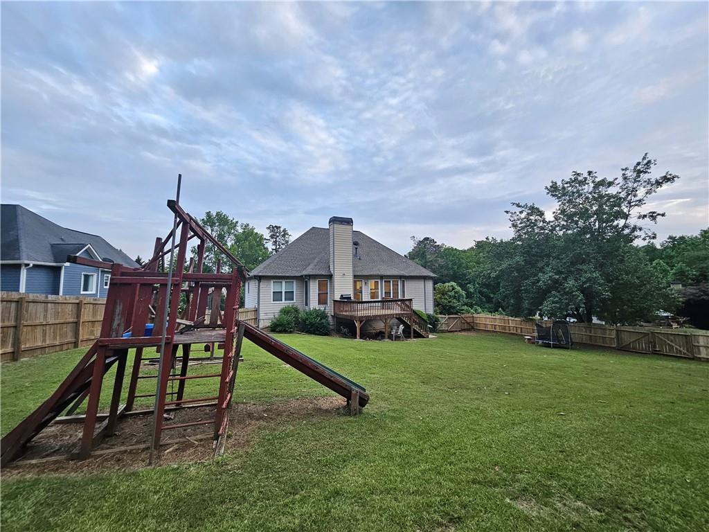 144 Hunters Trace Dallas, GA 30157 - Photo 31 of 34 a house view with a play ground in the back