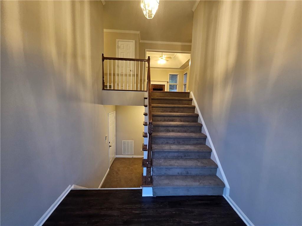 144 Hunters Trace Dallas, GA 30157 - Photo 4 of 34 a view of entryway and hall with wooden floor