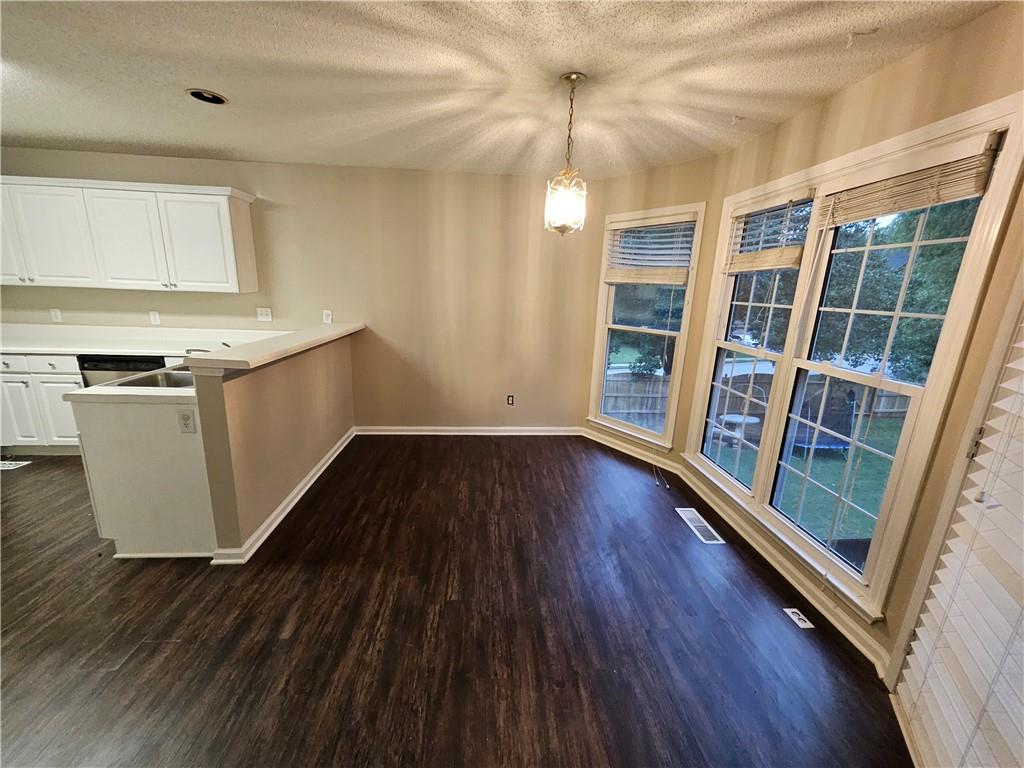144 Hunters Trace Dallas, GA 30157 - Photo 9 of 34 wooden floor in an empty room with a window