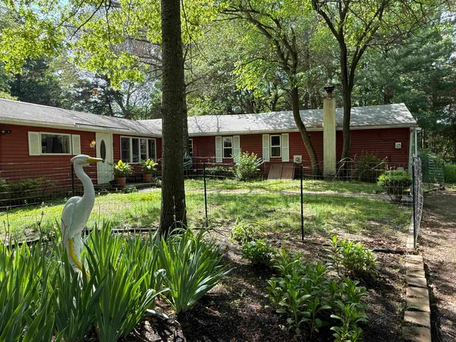 a backyard of a house with yard and green space