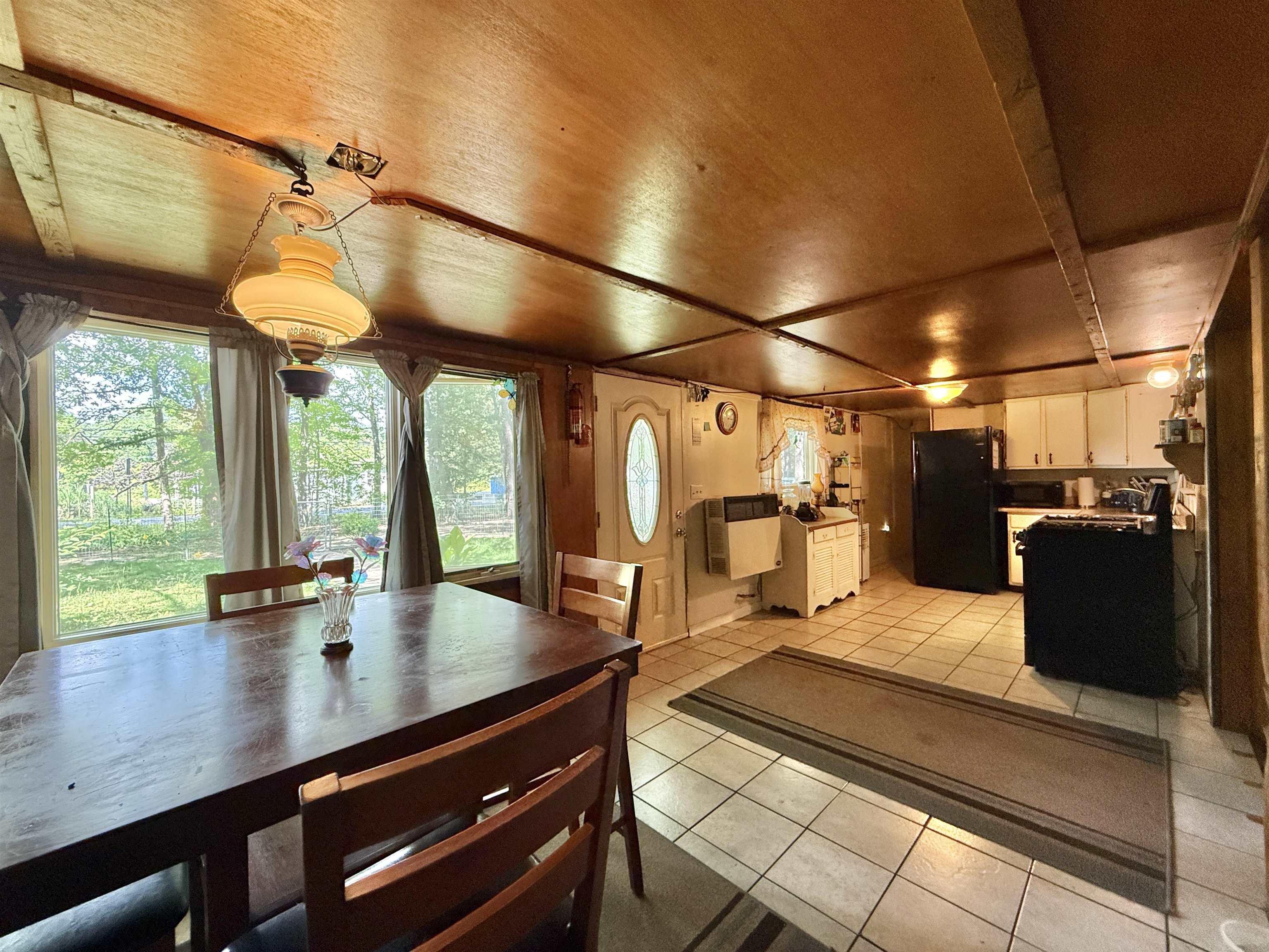 104 Head Of River Road Corbin City, NJ 08270 - Photo 19 of 50 a kitchen with a table chairs and wooden floor