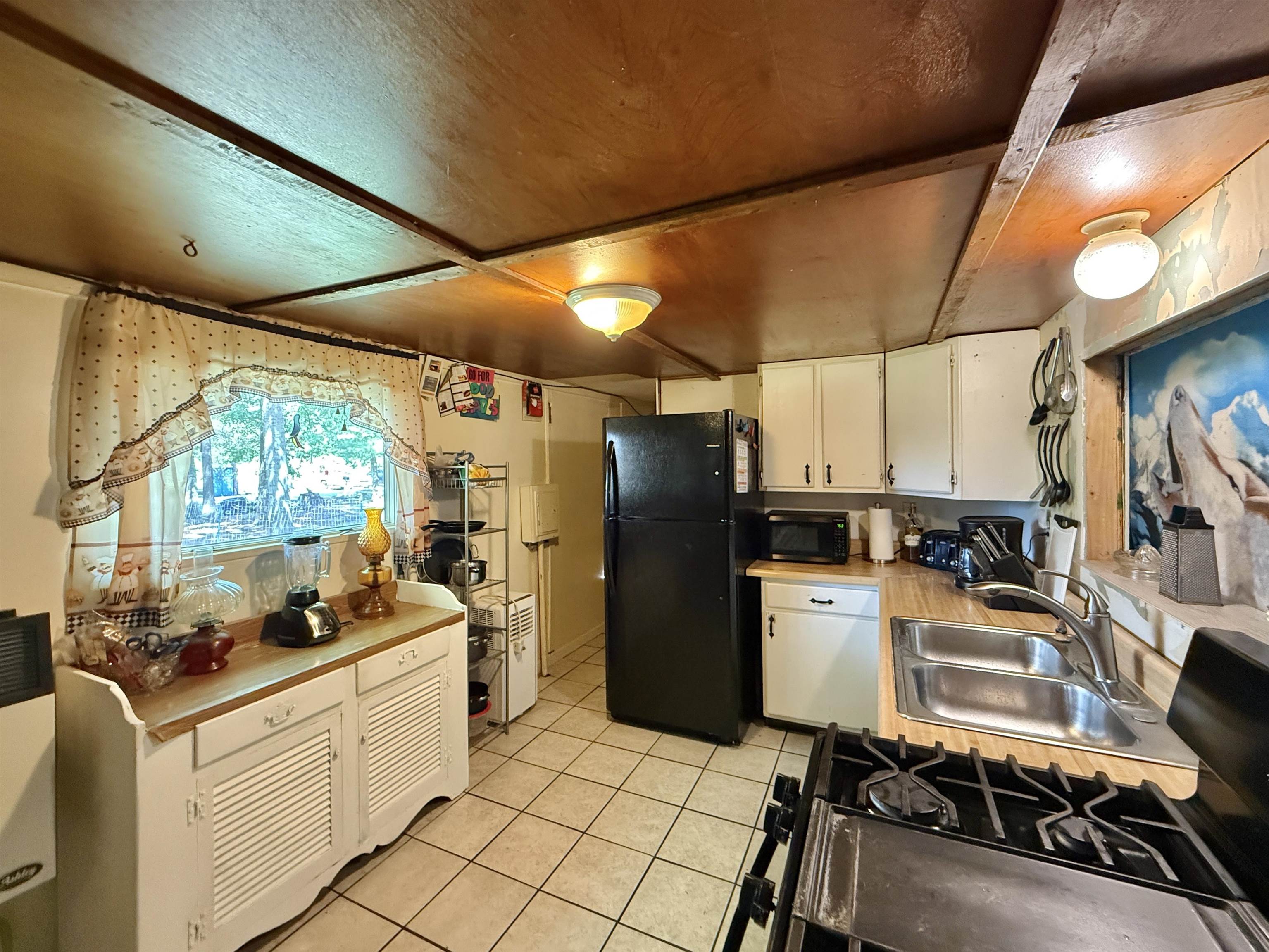 104 Head Of River Road Corbin City, NJ 08270 - Photo 20 of 50 a kitchen with refrigerator and cabinets