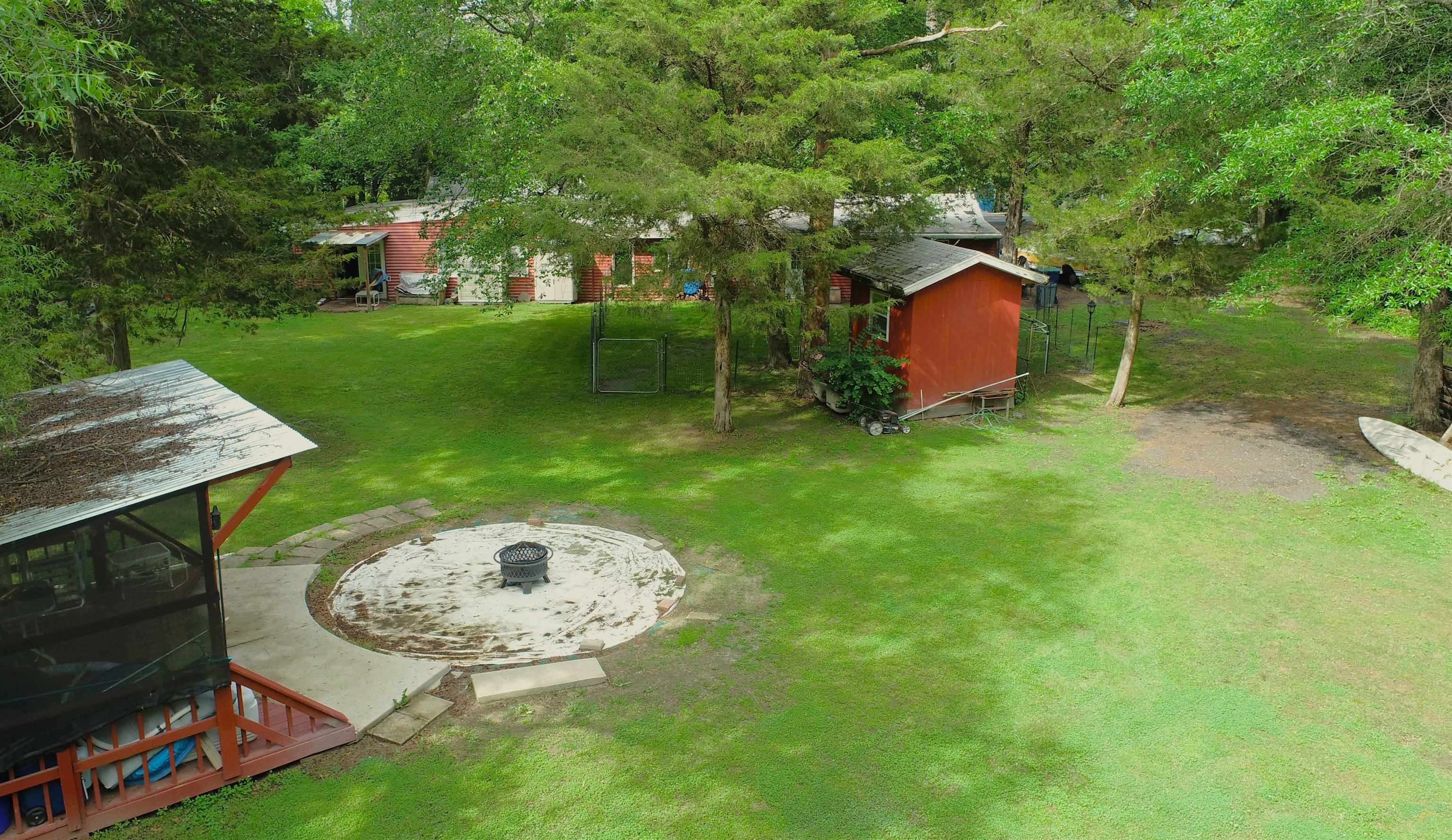 104 Head Of River Road Corbin City, NJ 08270 - Photo 5 of 50 a view of a backyard with a garden and entertaining space