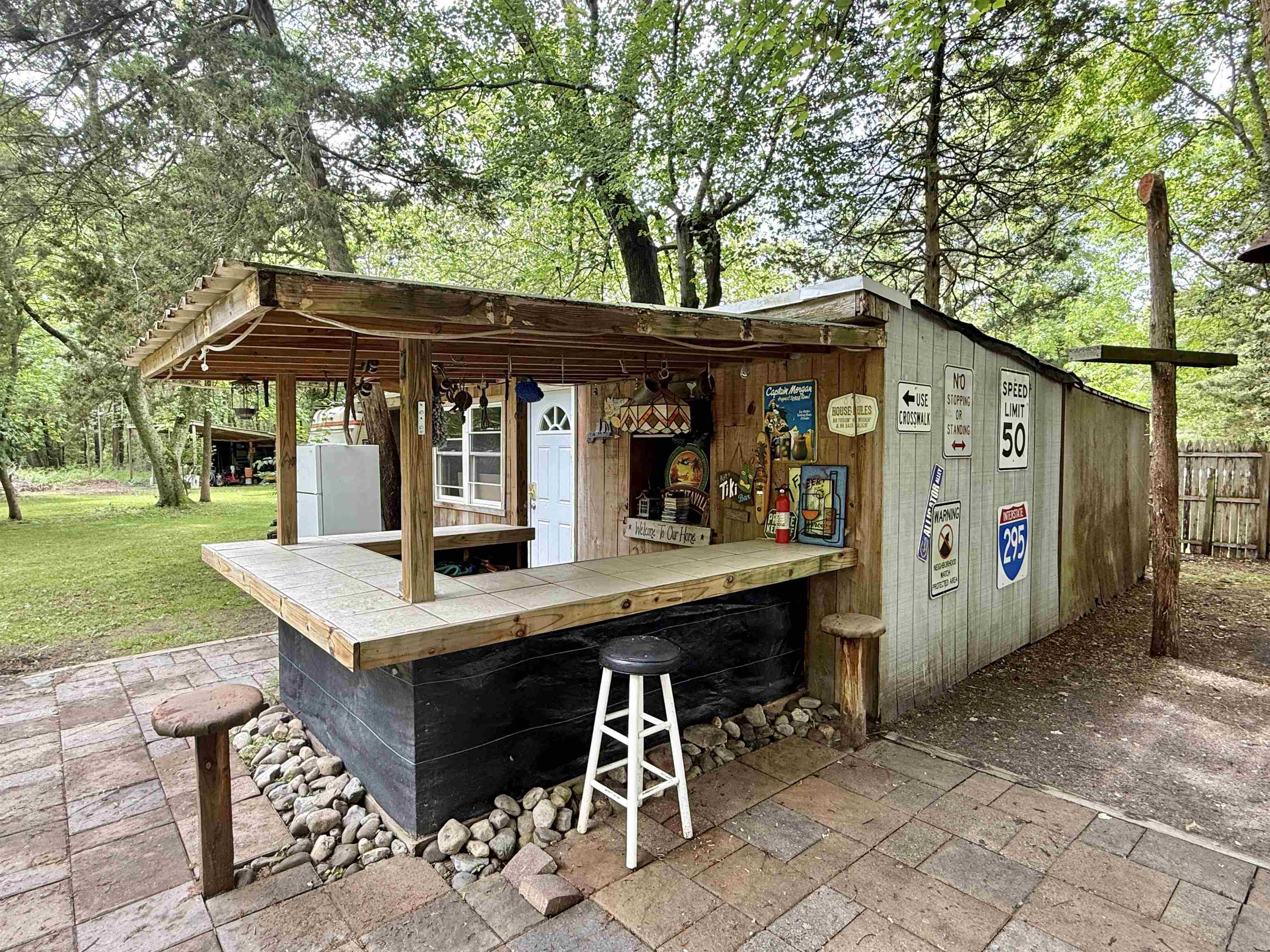 104 Head Of River Road Corbin City, NJ 08270 - Photo 10 of 50 a view of a chairs and table in the yard