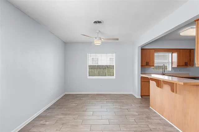 a view of a kitchen with a sink and a window