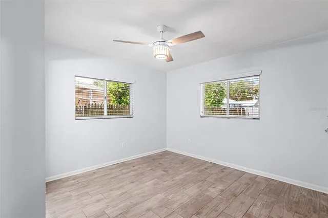 a view of an empty room with a window