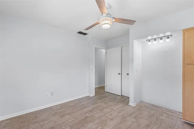 a bathroom with a sink toilet and a mirror