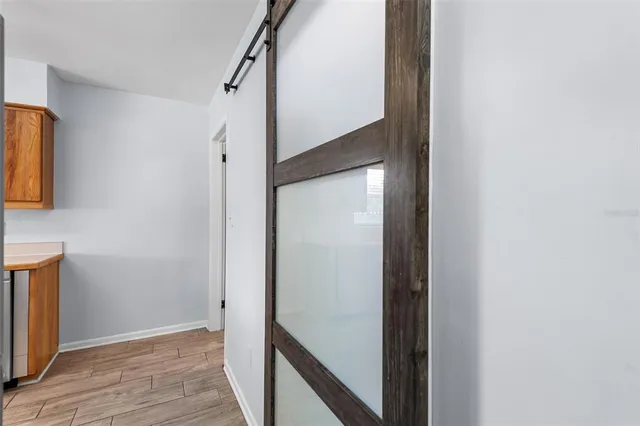 a view of a hallway with washer and dryer