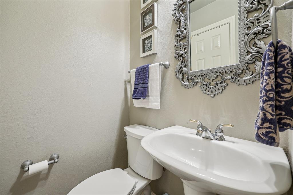 5603 Blazing Star Road Frisco, TX 75036 - Photo 16 of 39 a bathroom with a sink and mirror with toilet