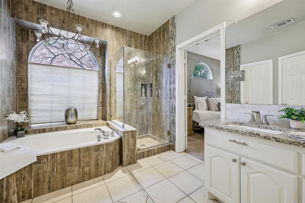 5603 Blazing Star Road Frisco, TX 75036 - Photo 20 of 39 a spacious bathroom with a tub sink and mirror