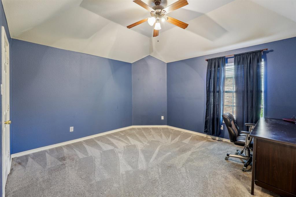 5603 Blazing Star Road Frisco, TX 75036 - Photo 23 of 39 a bedroom with a bed and ceiling fan