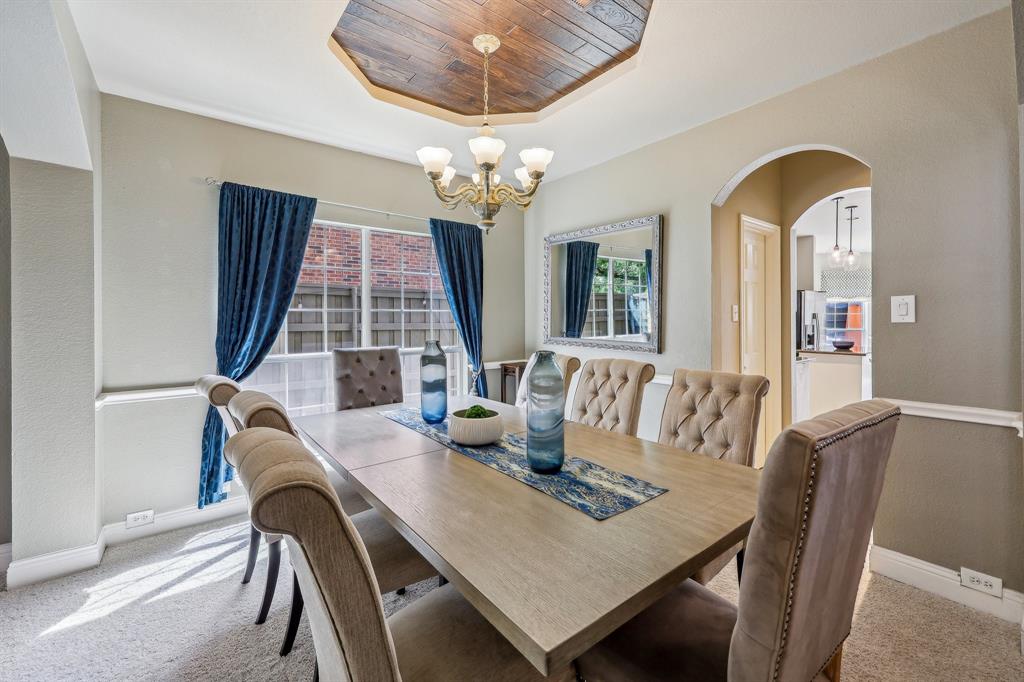 5603 Blazing Star Road Frisco, TX 75036 - Photo 5 of 39 a view of a dining room with furniture and chandelier