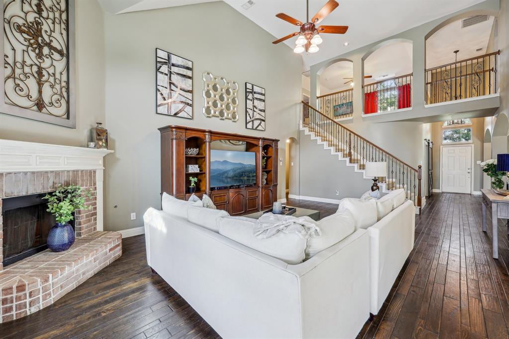 5603 Blazing Star Road Frisco, TX 75036 - Photo 8 of 39 a living room with furniture and a fireplace