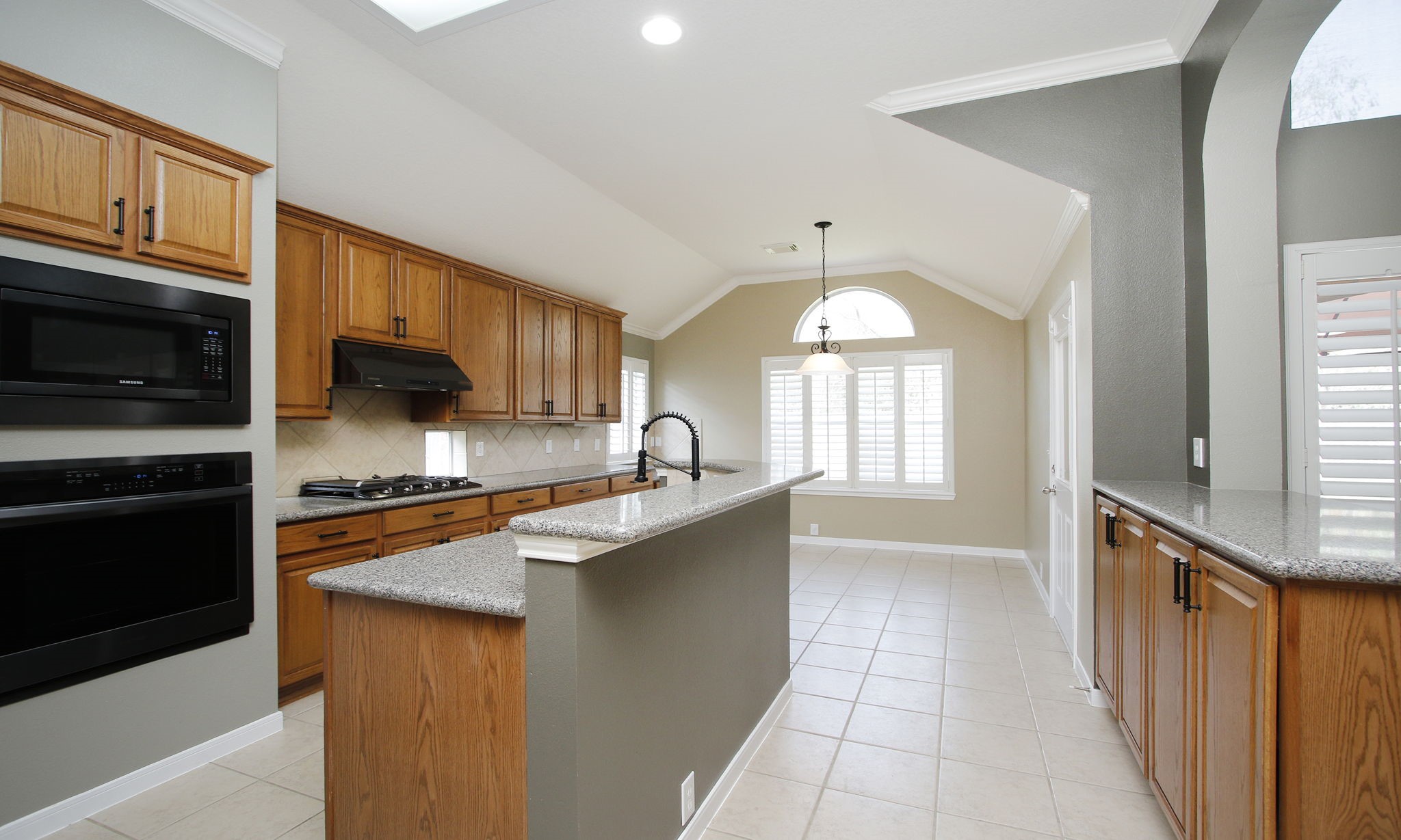 2802 Parkeston Drive Spring, TX 77388 - Photo 17 of 49 a kitchen with stainless steel appliances granite countertop a sink stove and refrigerator