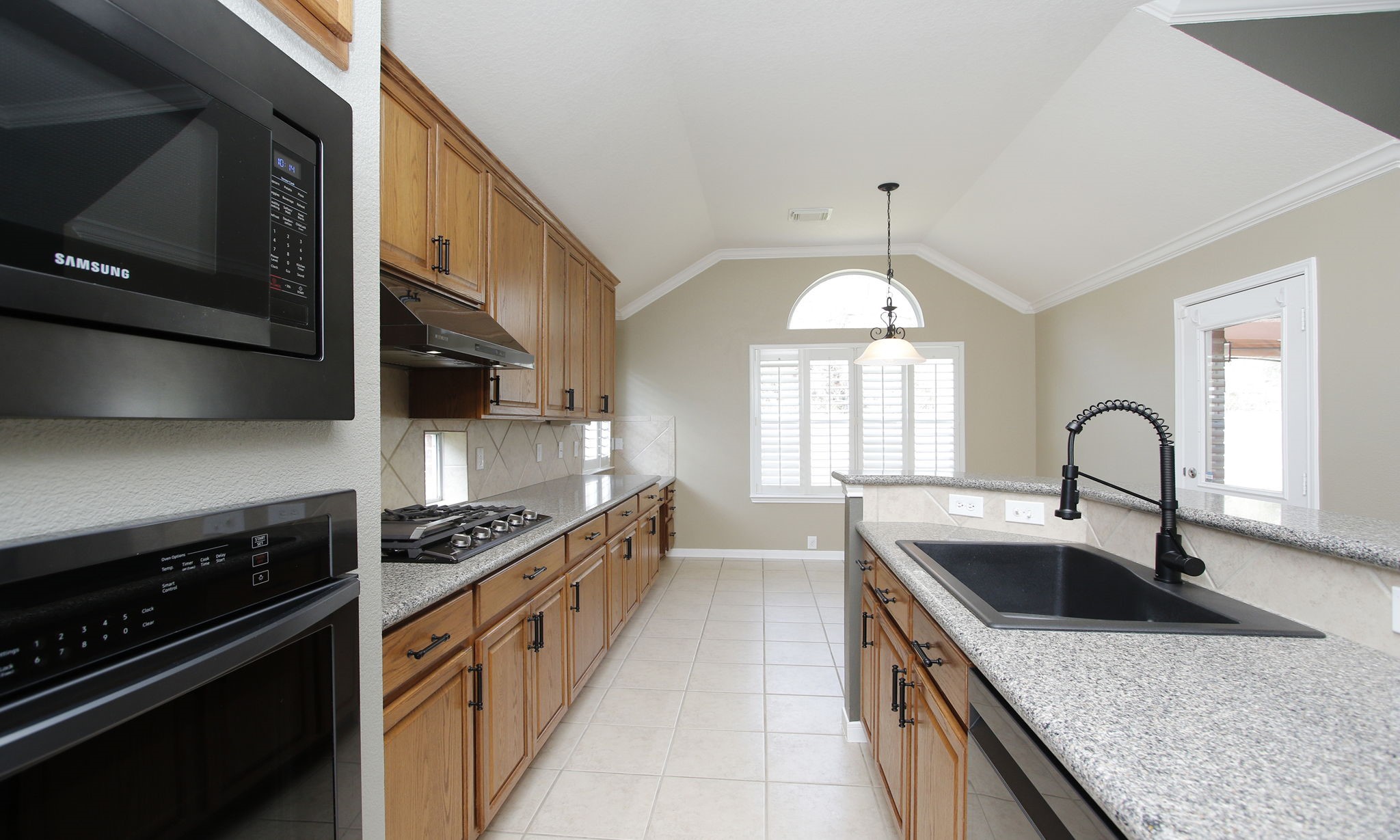 2802 Parkeston Drive Spring, TX 77388 - Photo 18 of 49 a kitchen that has a sink and a stove