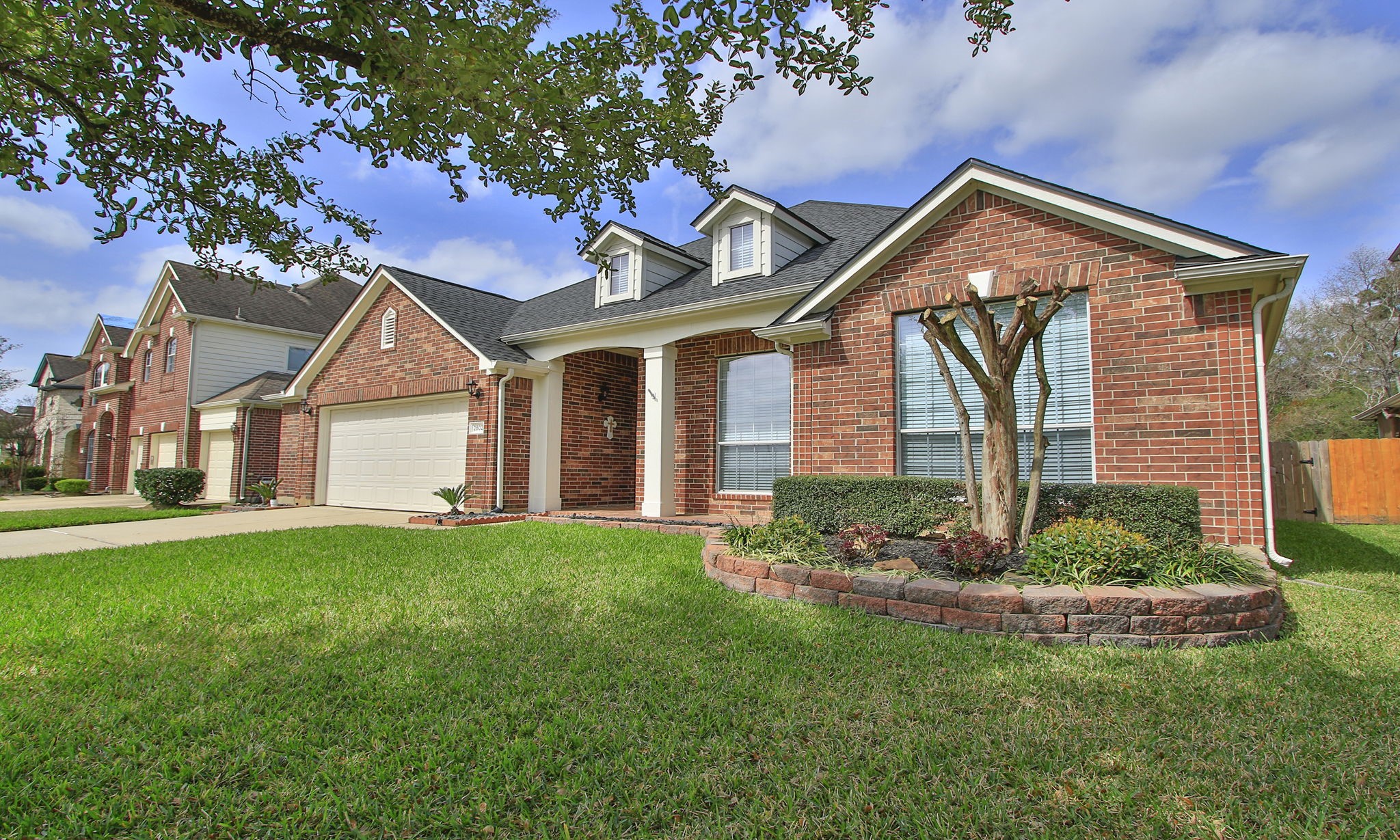 2802 Parkeston Drive Spring, TX 77388 - Photo 2 of 49 a front view of a house with a yard and garage