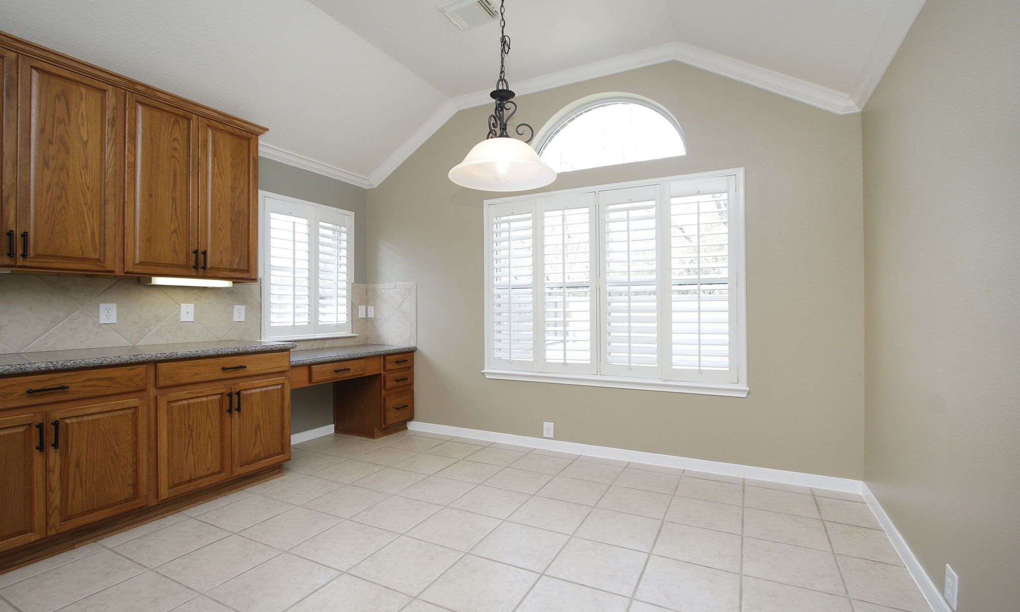 2802 Parkeston Drive Spring, TX 77388 - Photo 22 of 49 a large kitchen with granite countertop a stove a sink a window and dining table