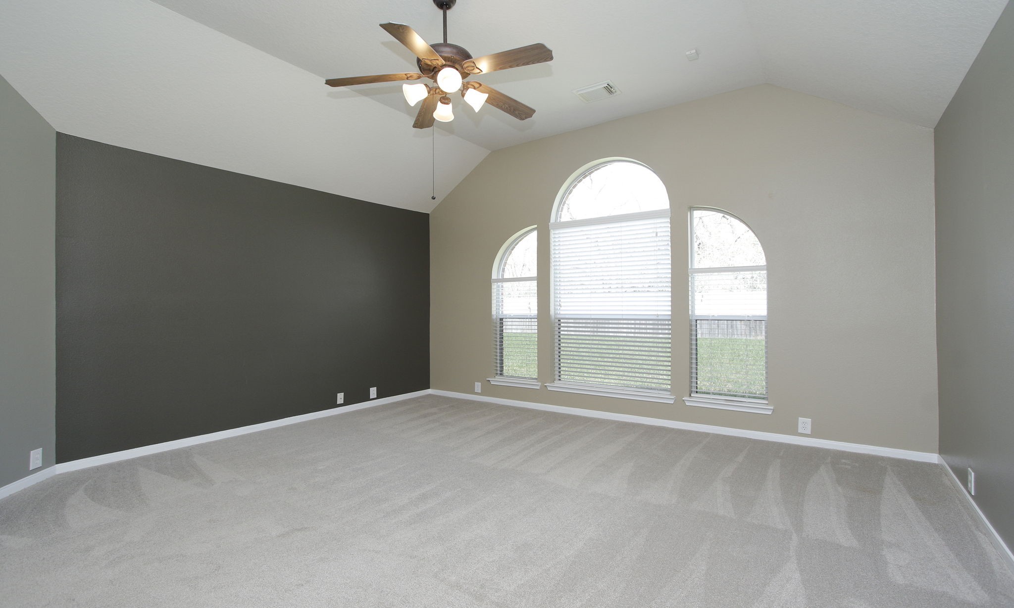2802 Parkeston Drive Spring, TX 77388 - Photo 24 of 49 an empty room with chandelier fan and windows
