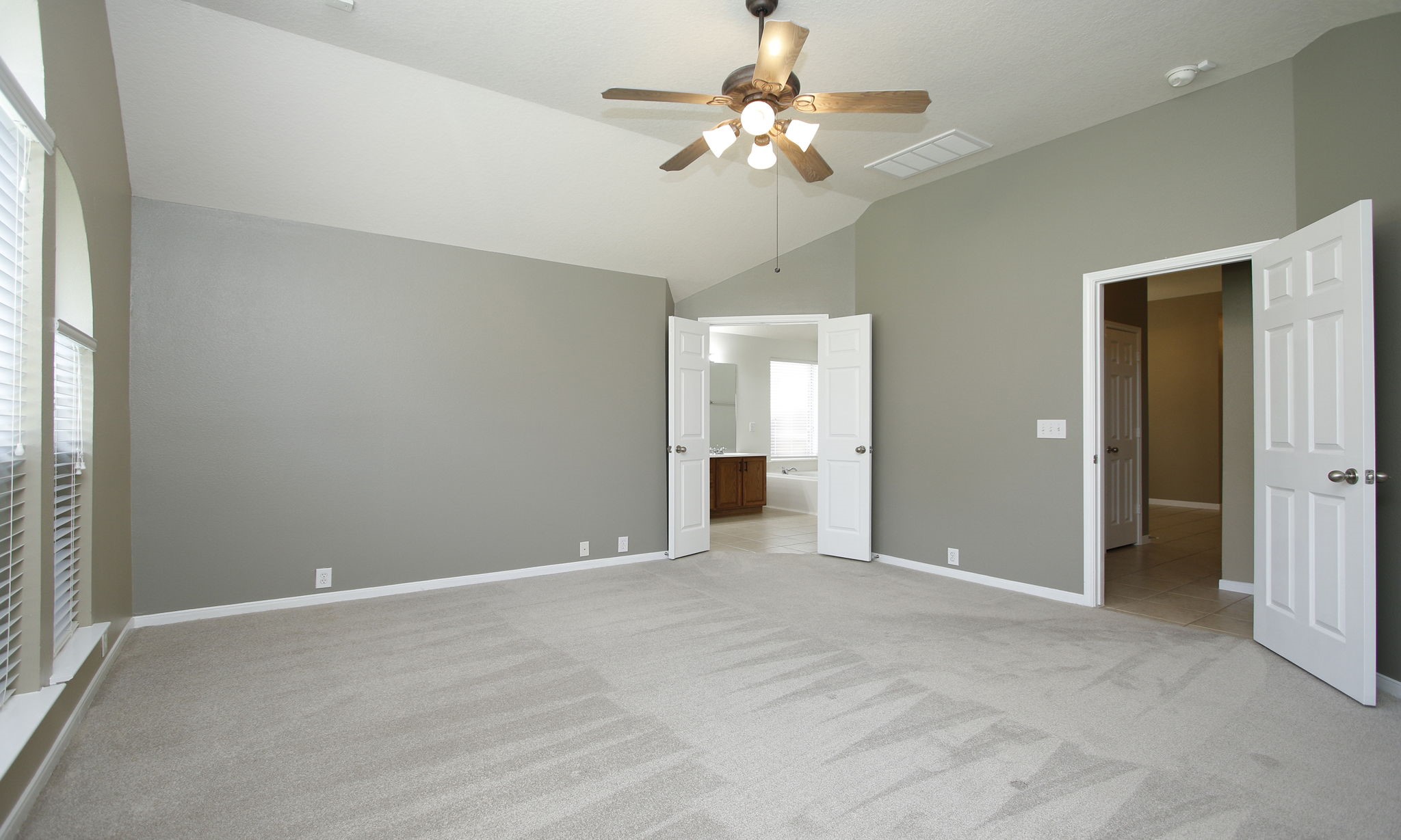 2802 Parkeston Drive Spring, TX 77388 - Photo 25 of 49 an empty room with chandelier fan and windows