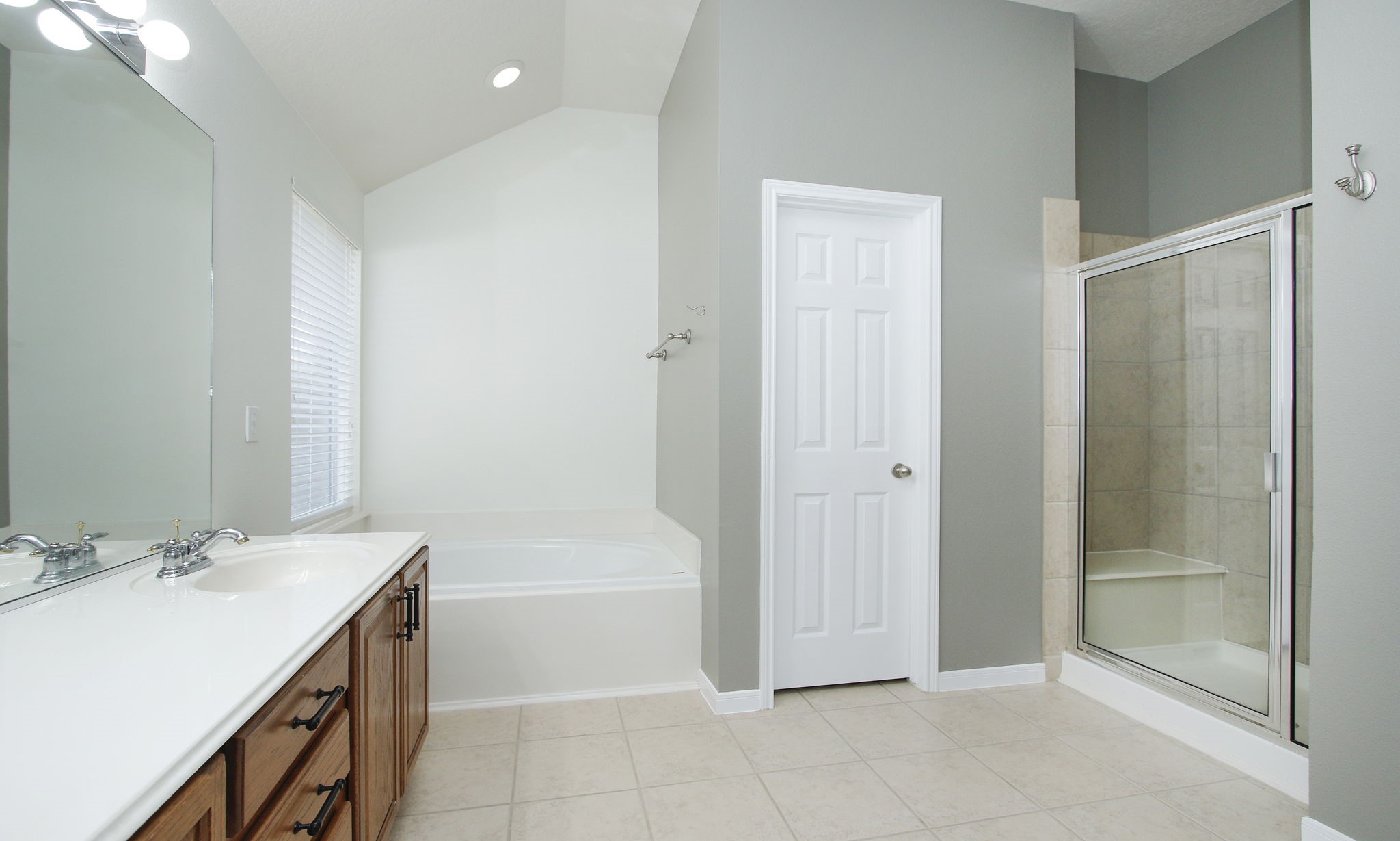 2802 Parkeston Drive Spring, TX 77388 - Photo 27 of 49 a bathroom with a granite countertop sink a mirror and a bathtub