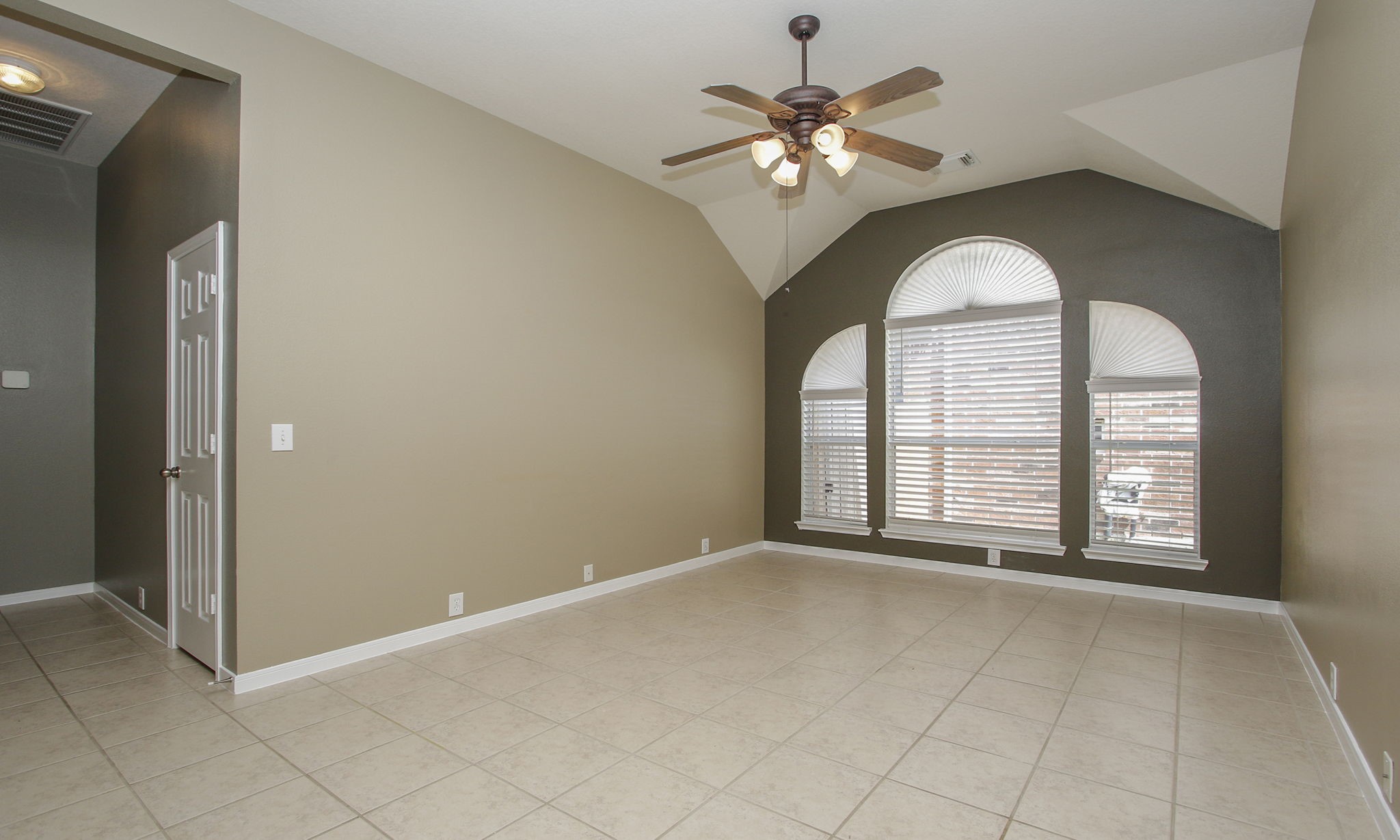 2802 Parkeston Drive Spring, TX 77388 - Photo 31 of 49 an empty room with windows and chandelier fan
